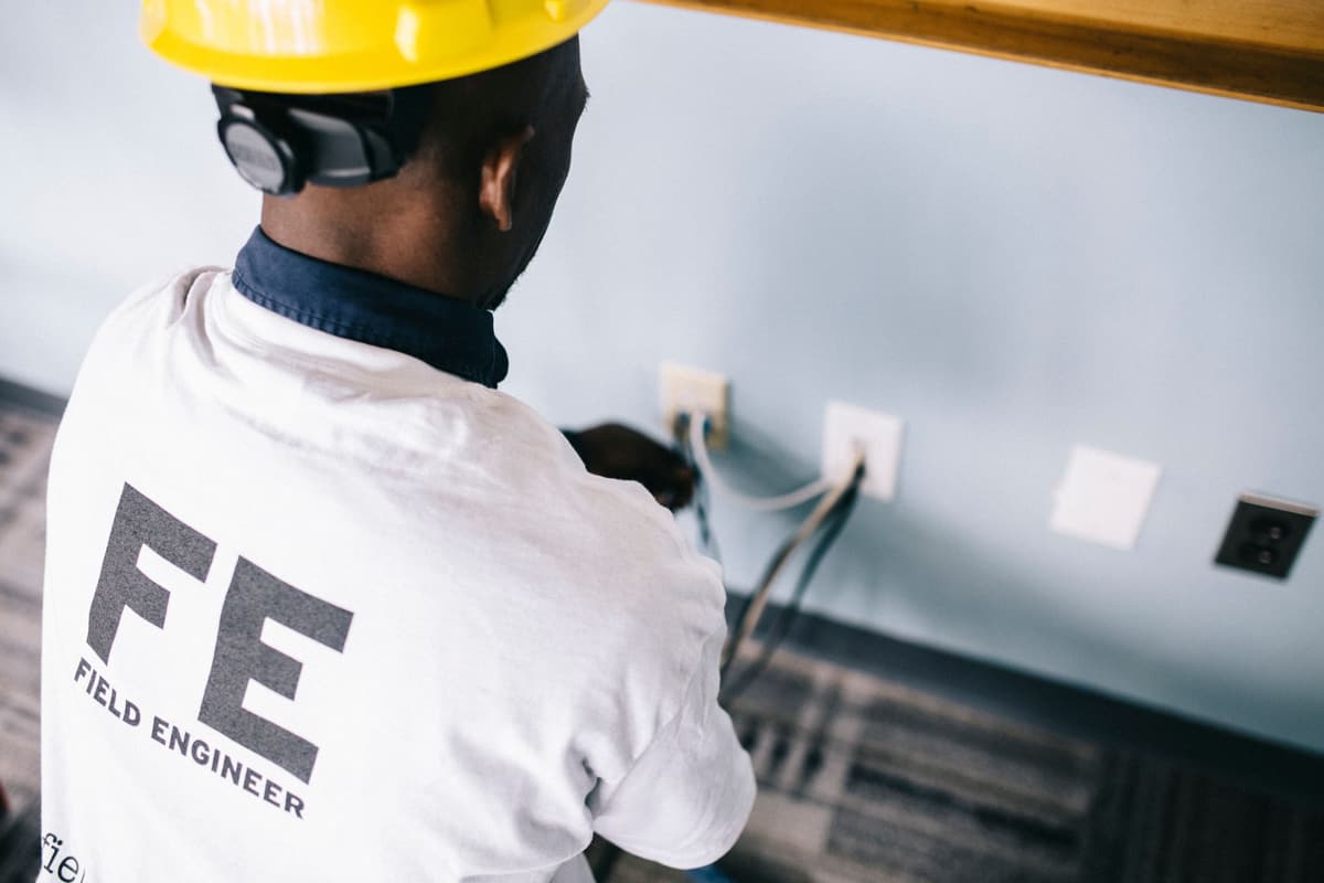 Electrician installing wiring and outlets